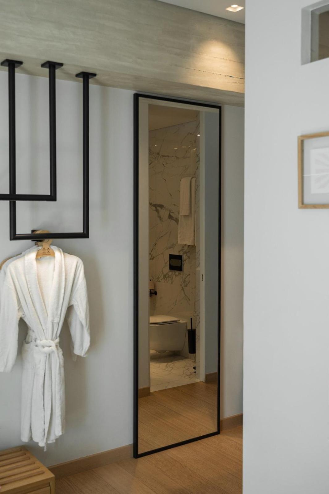 Coco-Mat Athens Jumelle Hotel Bagian luar foto A bathrobe hanging on a hanger